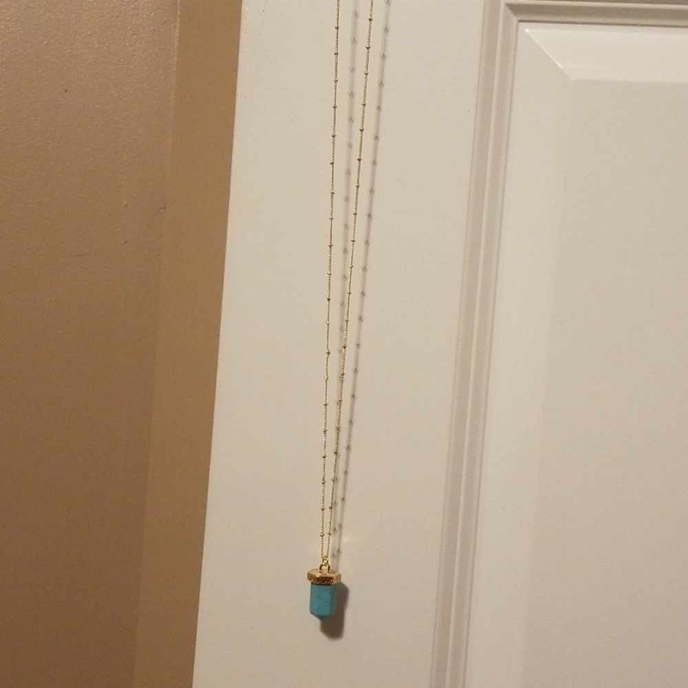 Gold plated neck with turquoise stone